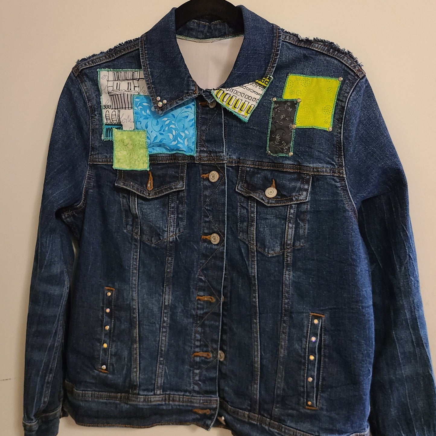 embellished jean jacket
green and blue patches
rhinestones